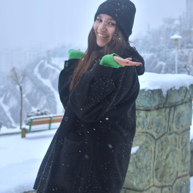 Lena Kapoor, Lead Design Curator at Ridge Plain Studio, reviewing corporate floral arrangements